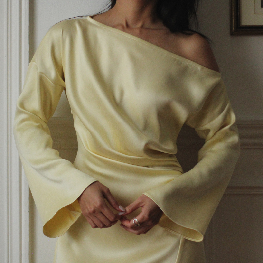 Close-up of the Bella Dress draped off-shoulder neckline