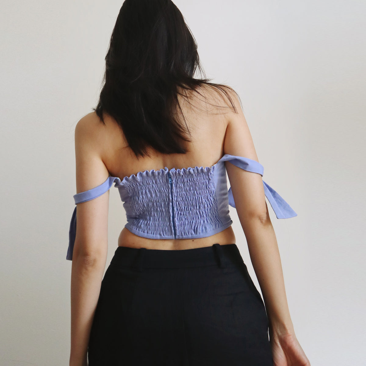 Back view of the Gemma corset top with shirred back and tie straps