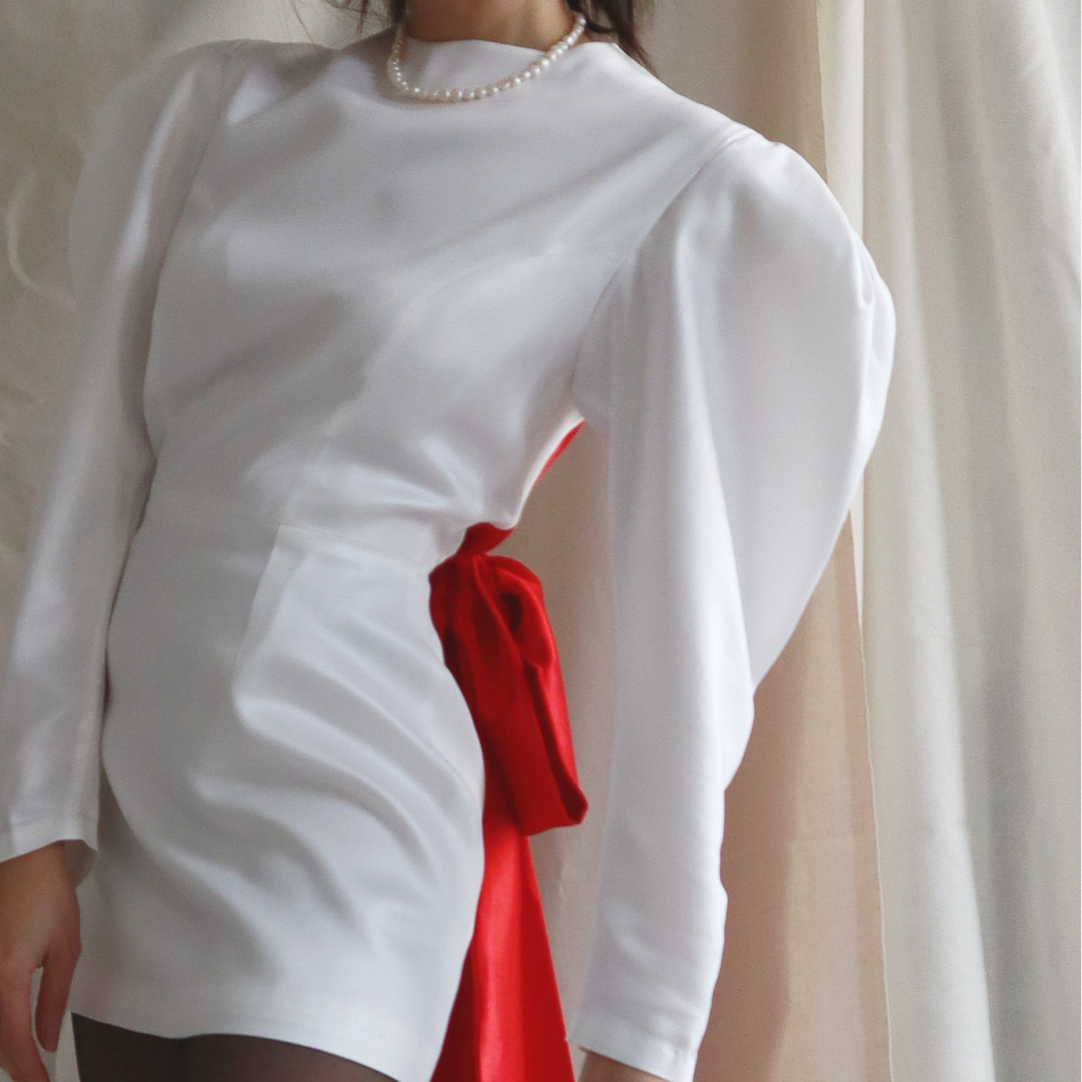 Harper Dress with red bow at the back, side view