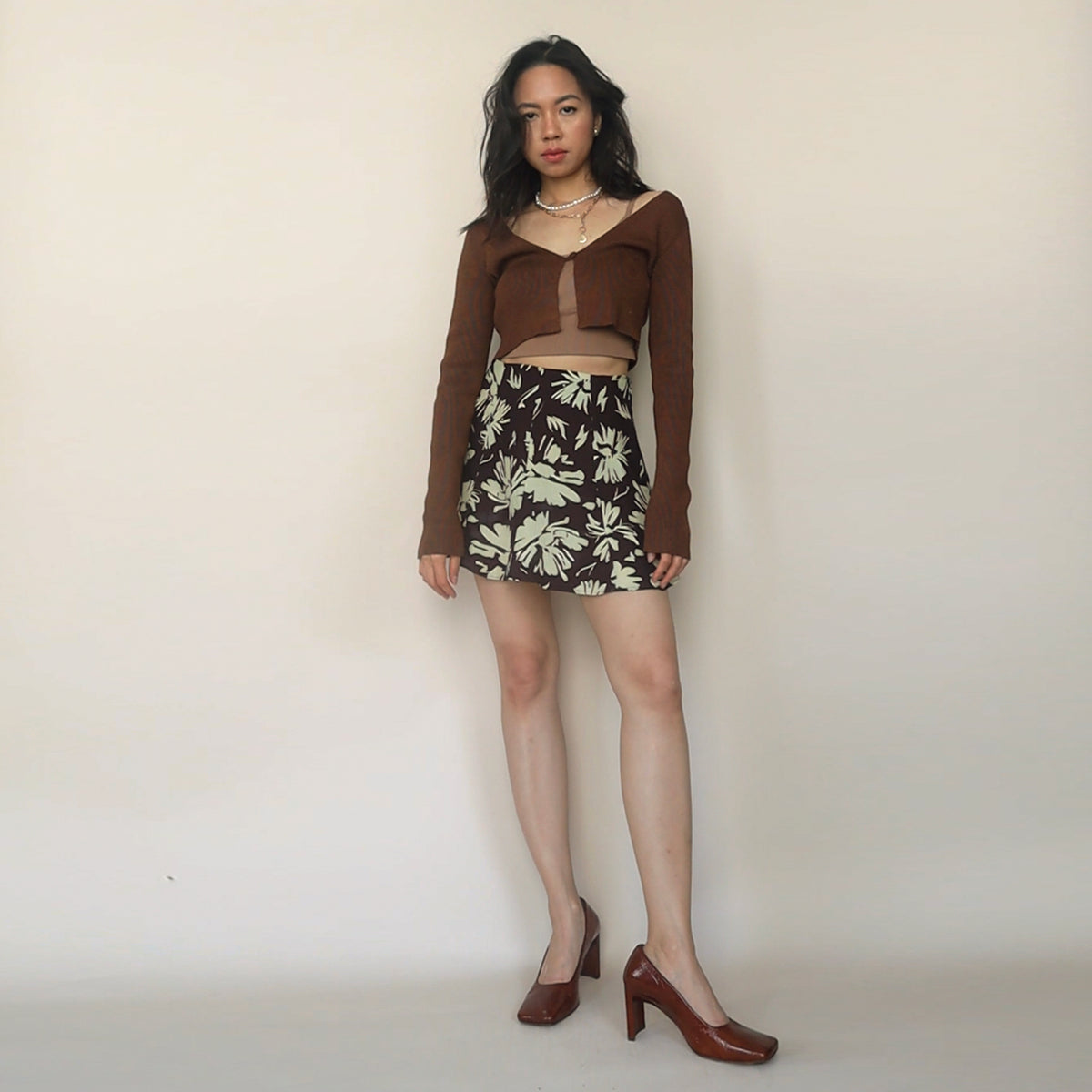 Joy Skirt in burgundy floral print styled with a brown cardigan
