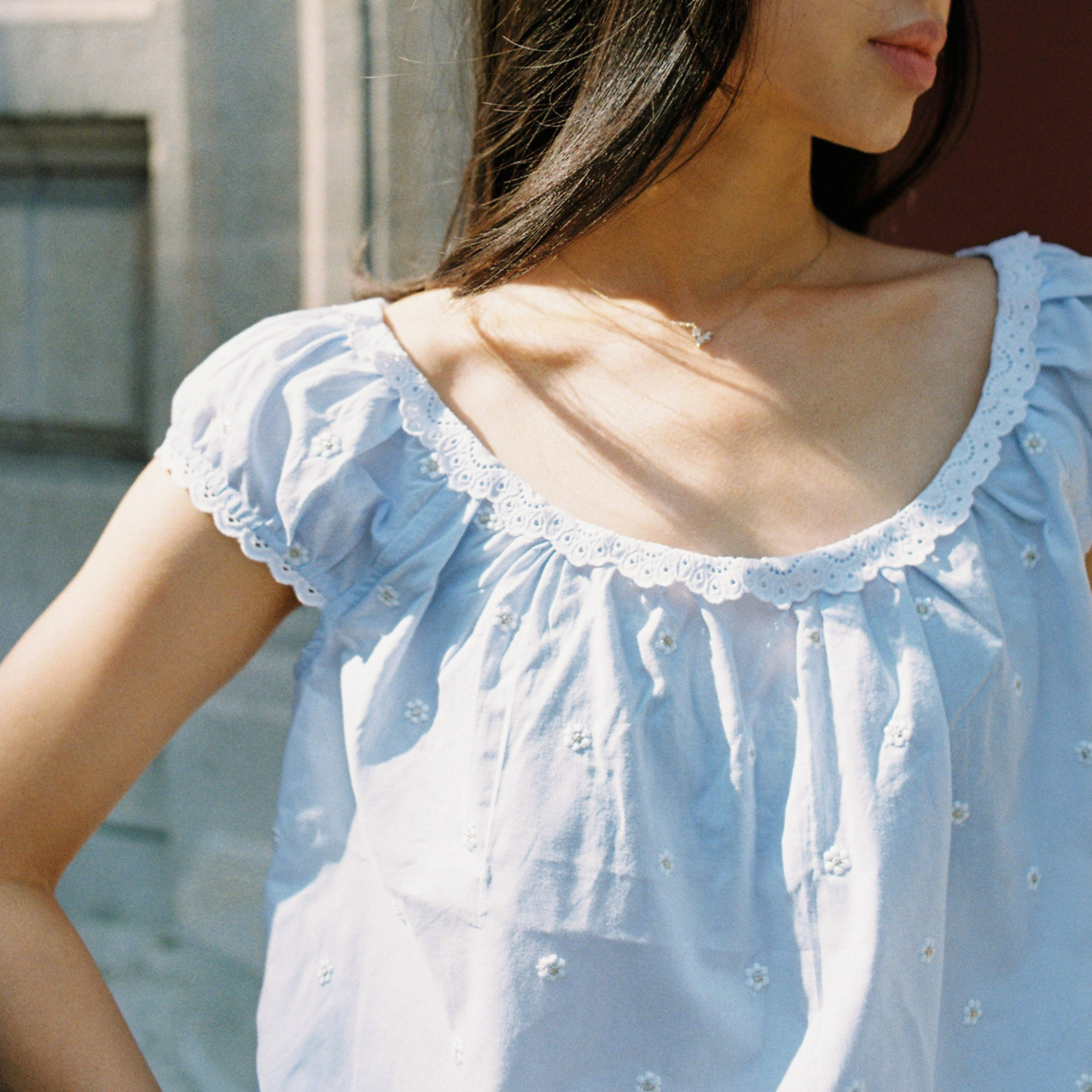 Close-up of the Linnea Blouse lace trim and gathered neckline