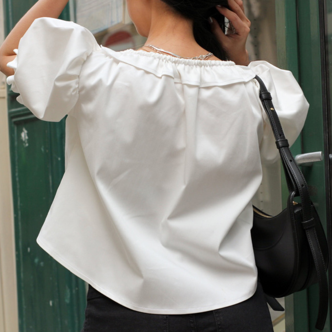 Back view of the white Mathilde puff-sleeve blouse