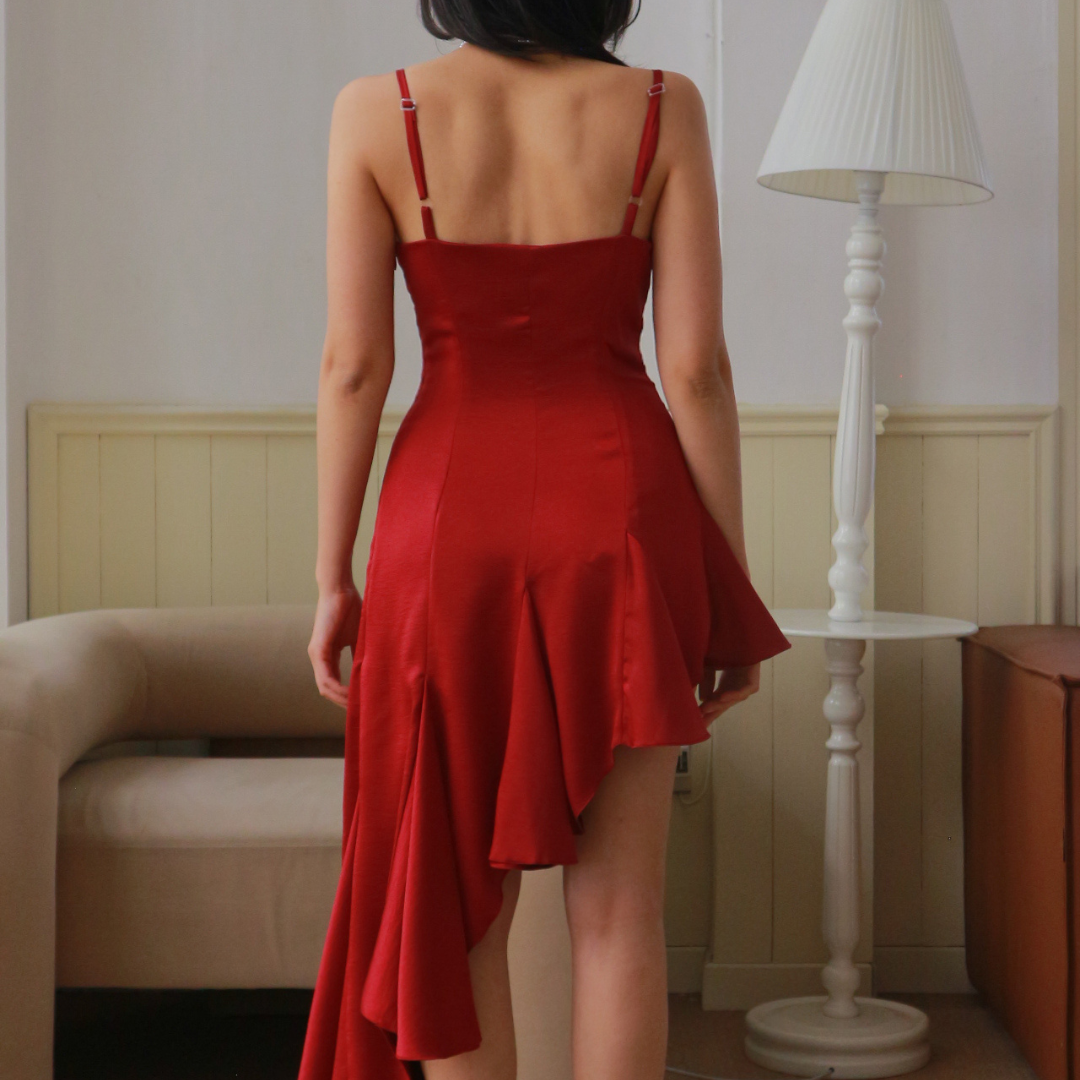 Back view of the red Rosa Kiss Dress with flowing godets